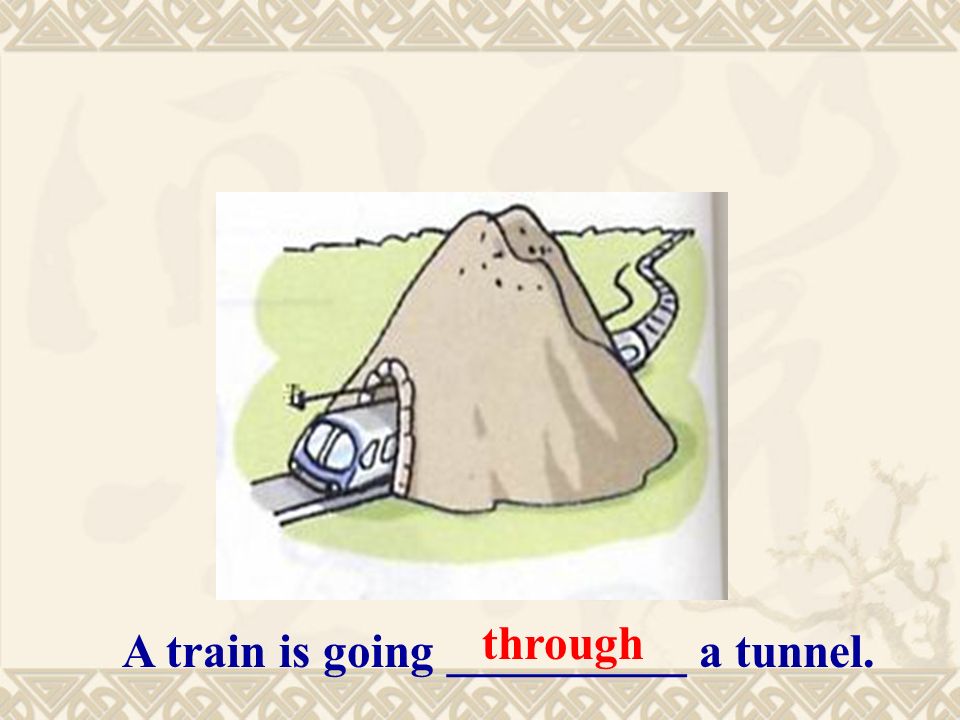 A train is going __________ a tunnel. through